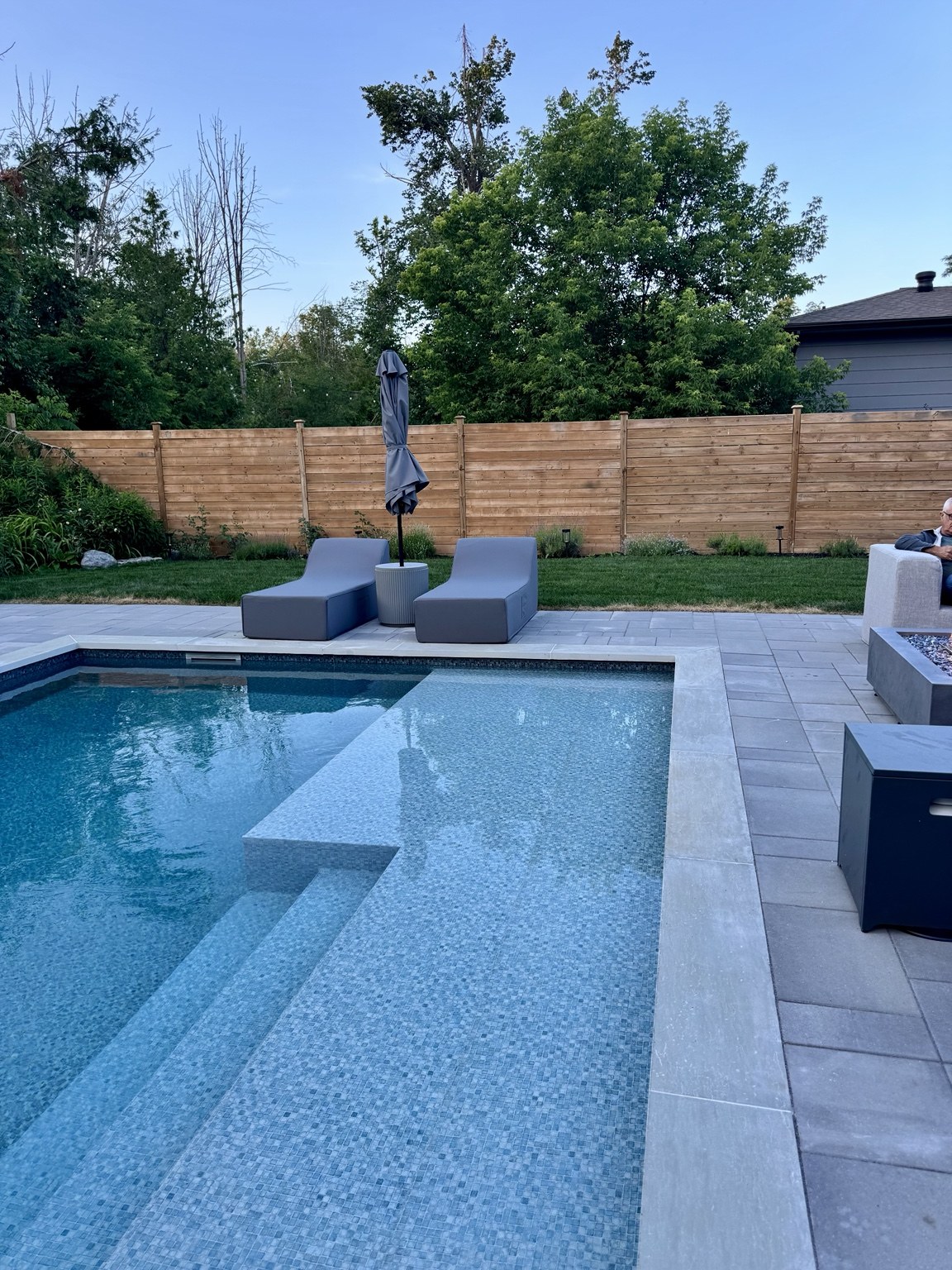 Interlock beside pool sun shelf